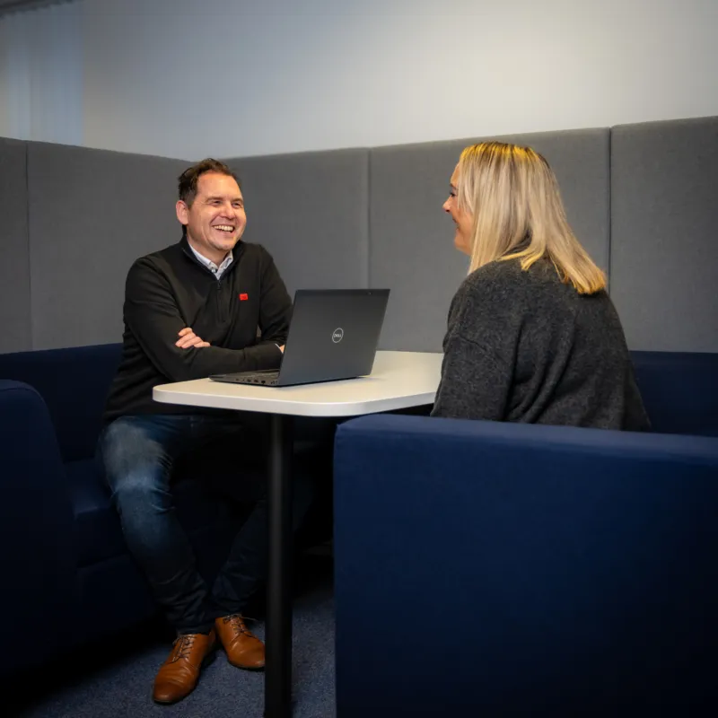 A man and a woman having a meeting